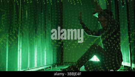 Image of binary code over asian man with vr headset working in server room Stock Photo
