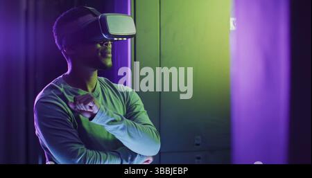 Image of data processing over african american man using vr headset in server room Stock Photo