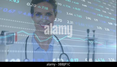 Image of financial data processing over doctor working in hospital Stock Photo