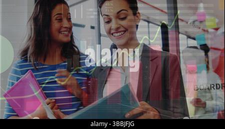 Image of statistical data processing over two diverse women discussing over documents at office Stock Photo