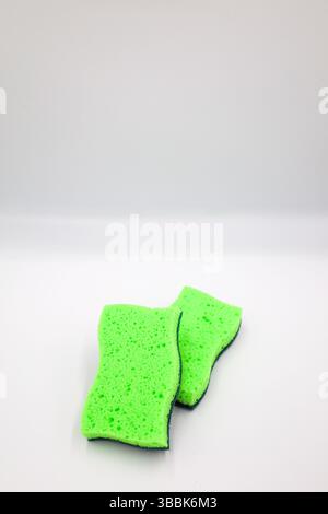 Green sponge in different positions and conditions Stock Photo