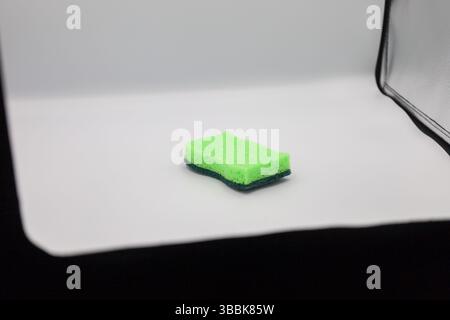 Green sponge in different positions and conditions Stock Photo