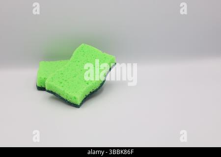 Green sponge in different positions and conditions Stock Photo