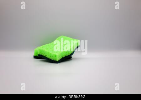 Green sponge in different positions and conditions Stock Photo