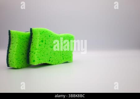 Green sponge in different positions and conditions Stock Photo