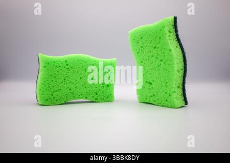 Green sponge in different positions and conditions Stock Photo