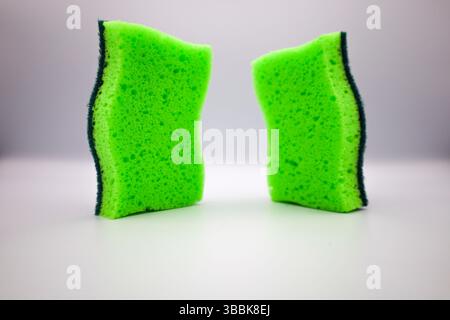 Green sponge in different positions and conditions Stock Photo