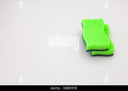 Green sponge in different positions and conditions Stock Photo