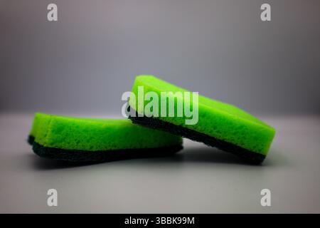 Green sponge in different positions and conditions Stock Photo