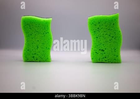 Green sponge in different positions and conditions Stock Photo