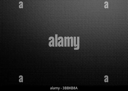 Black and white halftone gradient texture. A distinct woven pattern of small, raised squares or rectangles, creating a dark gray and black grid-like a Stock Photo
