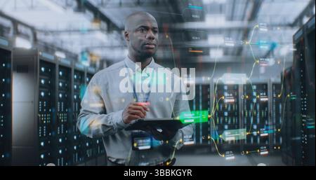 Futuristic Big Data Center with VFX: African American Administrator Using Digital Tablet. Animated Diagrams of Internet Traffic on Servers. Information Technology, Digitalization Concept. Medium Shot. Stock Photo
