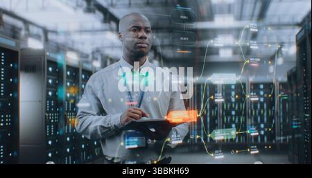 Futuristic Big Data Center with VFX: African American Administrator Using Digital Tablet. Animated Diagrams of Internet Traffic on Servers. Information Technology, Digitalization Concept. Medium Shot. Stock Photo