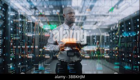 Futuristic Big Data Center with VFX: African American Administrator Using Digital Tablet. Animated Diagrams of Internet Traffic on Servers. Information Technology, Digitalization Concept. Medium Shot. Stock Photo