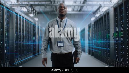 African American Administrator with Digital Tablet Walking in Futuristic Big Data Center with VFX. Animated Diagrams of Internet Traffic on Servers. Information Technology, Digitalization Concept. Stock Photo