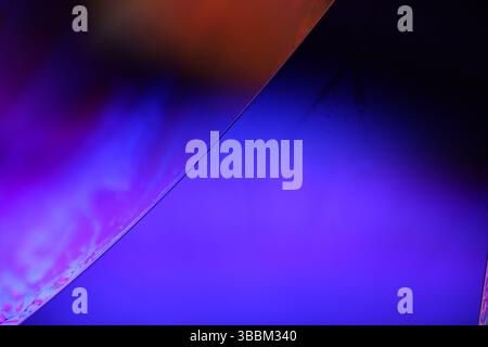 Deep purple liquid surface on black background, oil stains movement, bright chemistry, surreal background, deep galaxy atmosphere Stock Photo