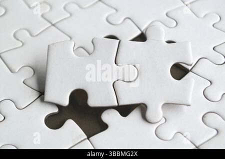 Connection of two puzzle parts in perfect harmony demonstrating logic clarity and teamwork in design. Stock Photo