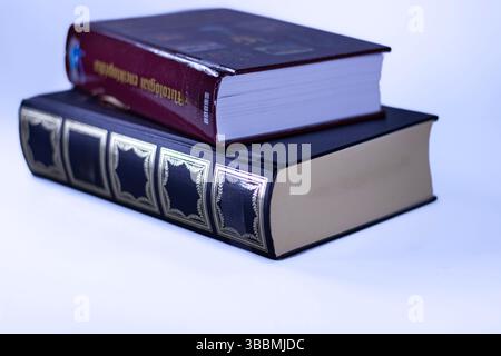Two hardcover books stacked on white background – educational and literary concept Stock Photo