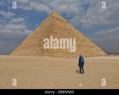 Pyramid of Khafre or of Chephren is middle of three Ancient Egyptian Pyramids of Giza, and is only one that still has its original cladding at the top. Stock Photo