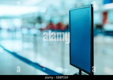 Blank board in lobby of modern airport Stock Photo
