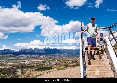 Father and four-year-old boy .descending stairs on historic Tenderfoot Mountain; Salida; Colorado; USA Stock Photo