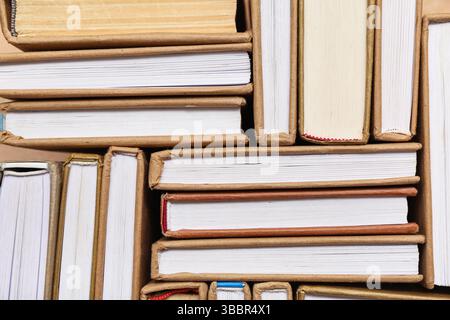 Many different half open books as background, top view Stock Photo