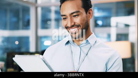 Happy, man and developer with tablet in office for programming, software update and troubleshooting. Male person, digital and coding app for website Stock Photo