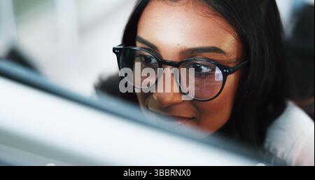 Woman, programmer or coding with glasses on computer for software development or web design at office. Female person, coder or developer with Stock Photo