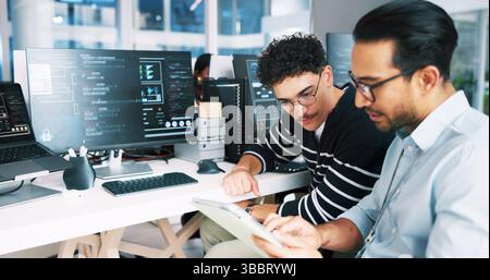 Web developer, tablet and coding in office for software, system or website update advice. Night, programmer and backend engineer with feedback for Stock Photo