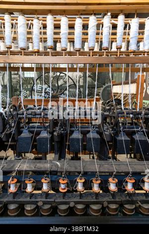 Cotton spinning machinery at Cromford Mills visitor centre, Derbyshire, England. Stock Photo