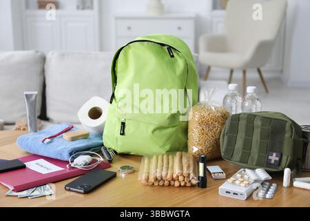 Survival kit. Different emergency supplies on wooden table indoors Stock Photo