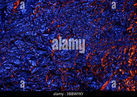 Red and blue Shiny aluminum foil texture close up Stock Photo
