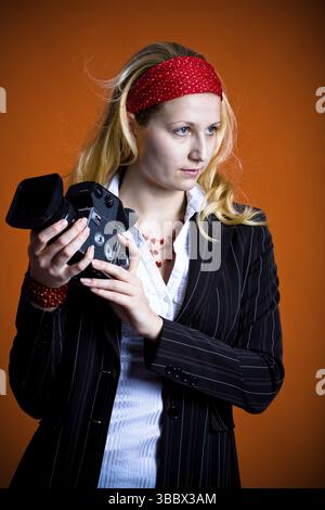 A paparazzi girl in action Stock Photo