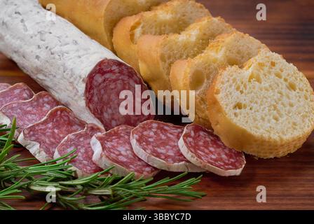 Fuet - traditional Catalan thin dry cured pork sausage with peculiar taste. Stock Photo