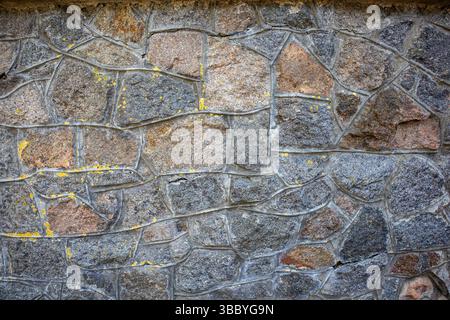 Close-up of natural stone wall. Beautiful background or texture. Stock Photo