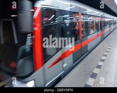 Modern subway train in motion at underground platform in Prague Stock Photo