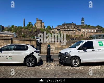 Electric vehicle EV Car charging point on street, East Market Street, Edinburgh Scotland Stock Photo