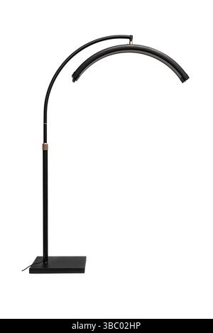 Tall black arc floor lamp with curved LED light and square base, isolated on white. Stock Photo