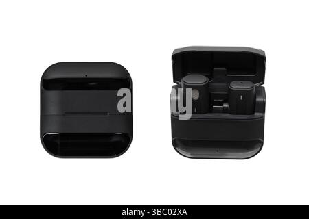 Compact wireless microphone system with charging case, closed and open views. Stock Photo
