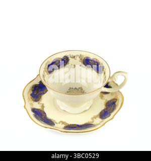 Porcelain vintage cup and saucer isolated on white background. Vintage Bavarian teaware. Stock Photo