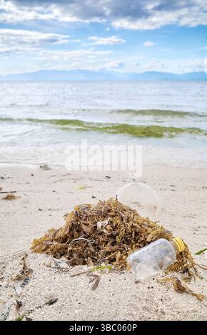 Plastic garbage on tropical beach, selective focus. Stock Photo