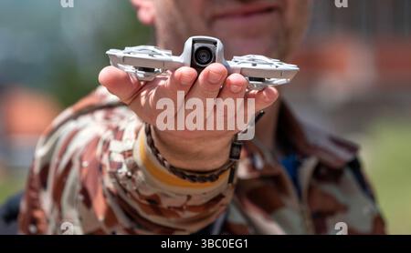 : Ready for Flight: Tiny Drone in Hand Stock Photo