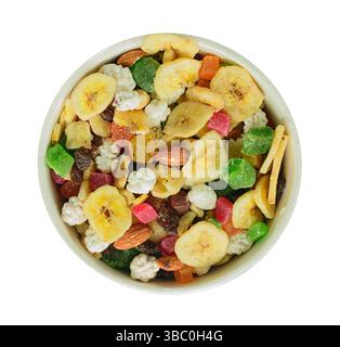 sweet mix with dried fruits and nuts in bowl, above view Stock Photo