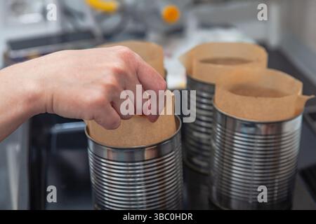 Steel molds on a roasting pan prepared for baking Easter bread. Stock Photo