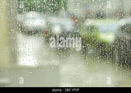 Blurred raindrops on a window pane Stock Photo