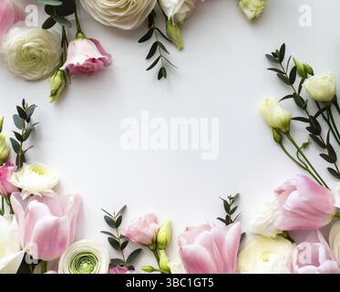 Pink and white flowers border design over the white background, top view Stock Photo