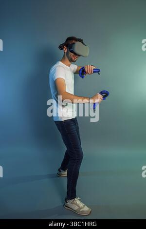 Man using a gaming gadget for virtual reality. Augmented reality in gaming Stock Photo