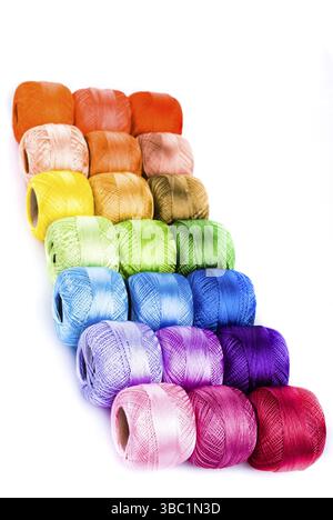 The collection of threads twisted in a ball is located on a white background Stock Photo