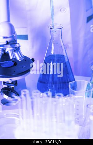 Scientist shows a diffusion in the flask Stock Photo
