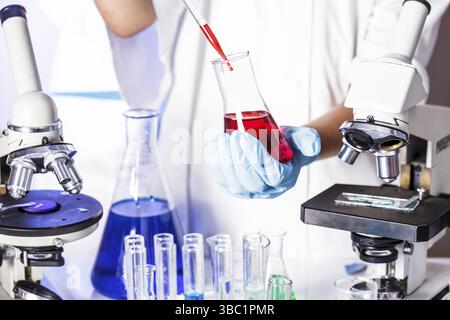 Scientist shows a diffusion in the Petri dish Stock Photo